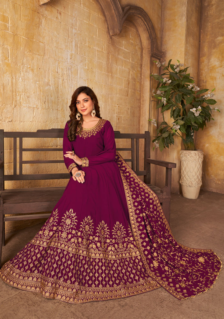 Beautiful magenta salwar kameez showcasing stunning craftsmanship, perfect for weddings and special occasions.