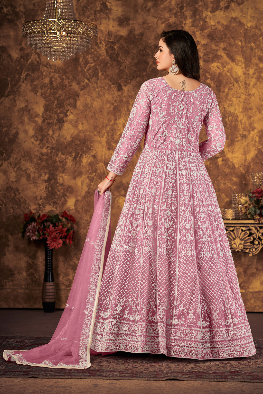 Stylish pink salwar kameez featuring intricate design, perfect for enhancing your festive wardrobe.