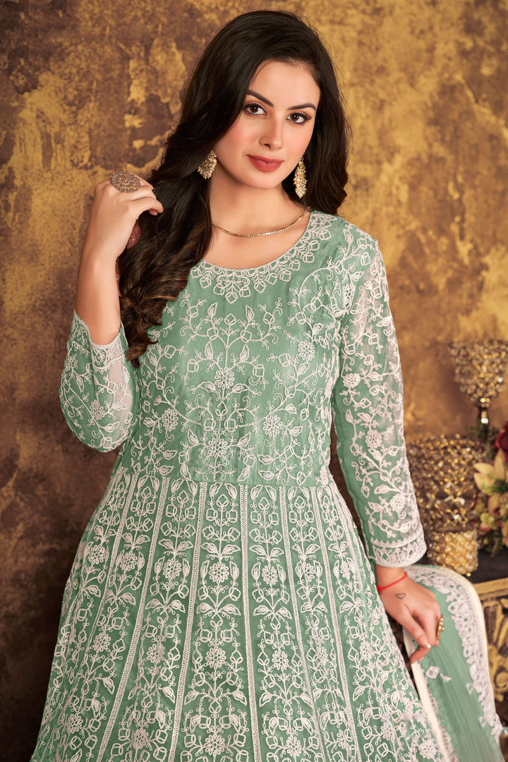 Beautifully crafted light green salwar kameez with stunning embroidery, perfect for weddings and special gatherings.