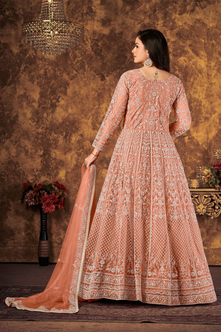 Stylish peach salwar kameez showcasing delicate embroidery, perfect for enhancing your festive wardrobe.