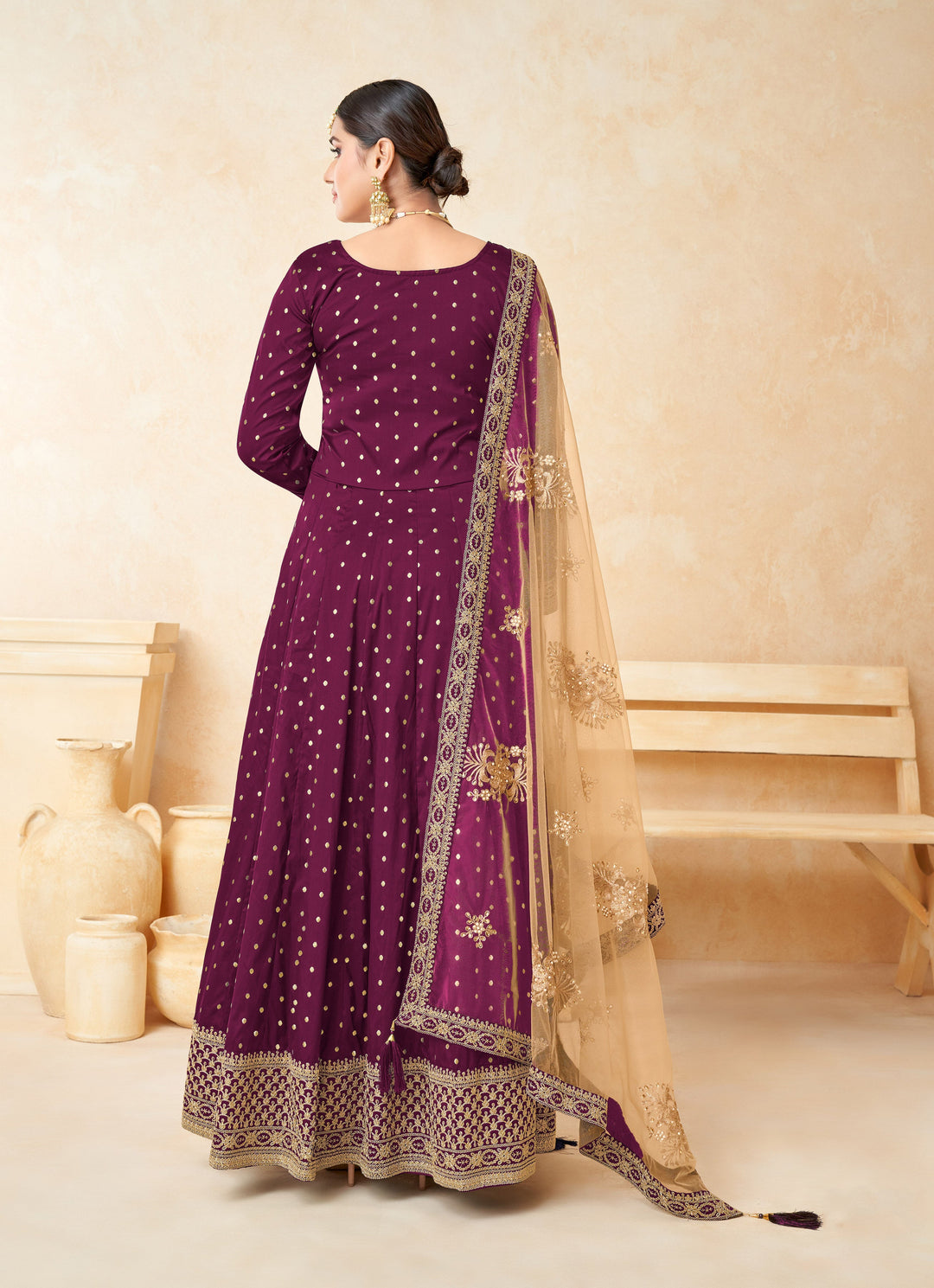 Beautifully crafted magenta salwar kameez showcasing exquisite craftsmanship, perfect for weddings and special occasions.