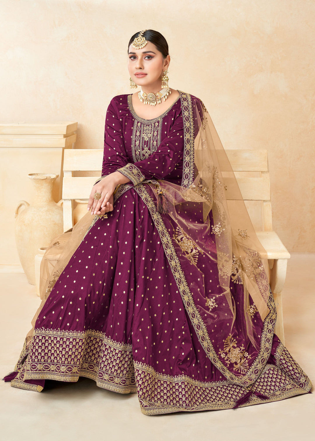 Stylish magenta salwar kameez with intricate zari detailing, perfect for enhancing your festive wardrobe.