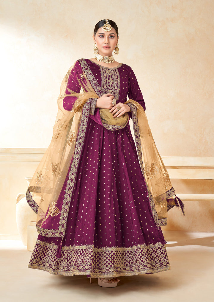 Stand out in magenta salwar kameez featuring stunning zari work, ideal for festive events and celebrations.