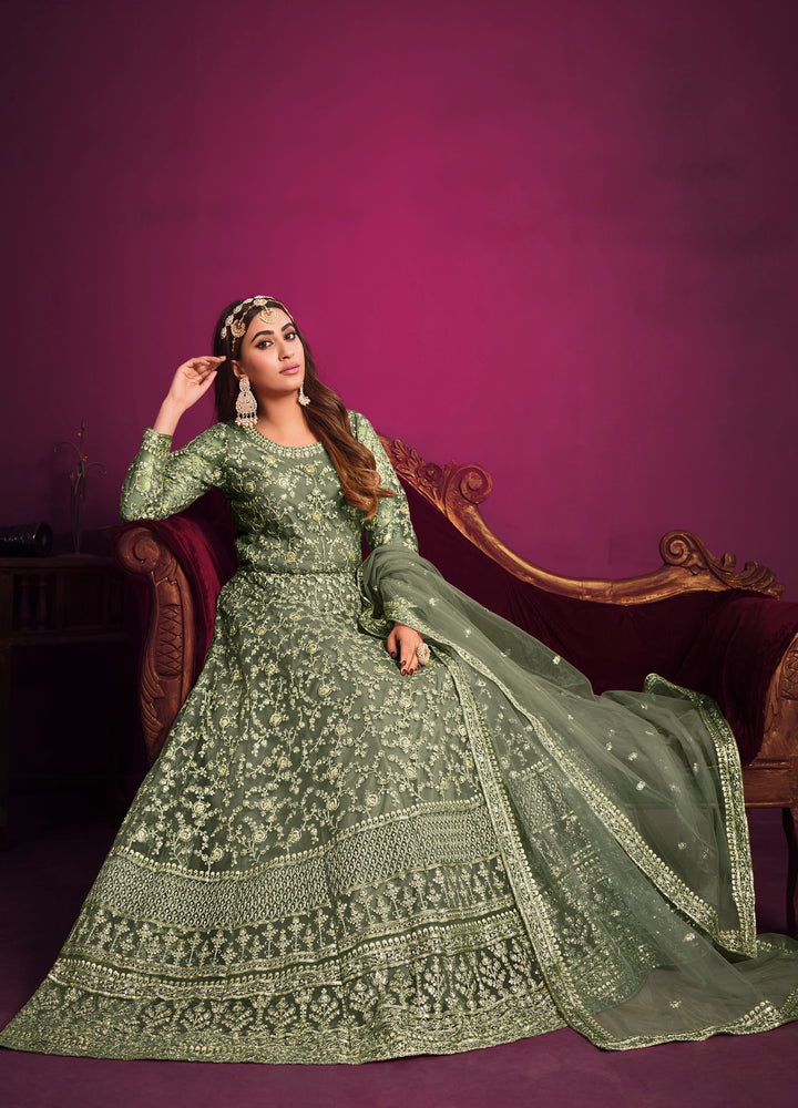 Elevate your wardrobe with khakhi green salwar kameez featuring intricate embroidery, perfect for special occasions.