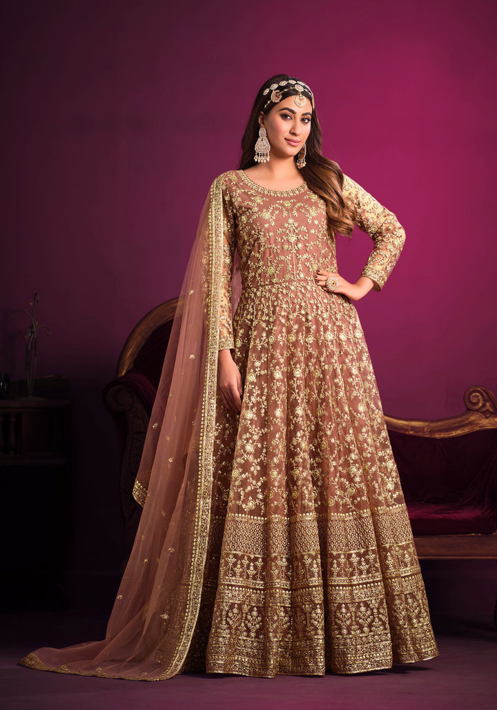 Beautifully crafted coral salwar kameez showcasing exquisite design, perfect for weddings and special gatherings.