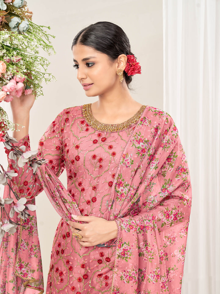 Beautifully crafted pink net salwar kameez showcasing exquisite detailing for weddings and special occasions.