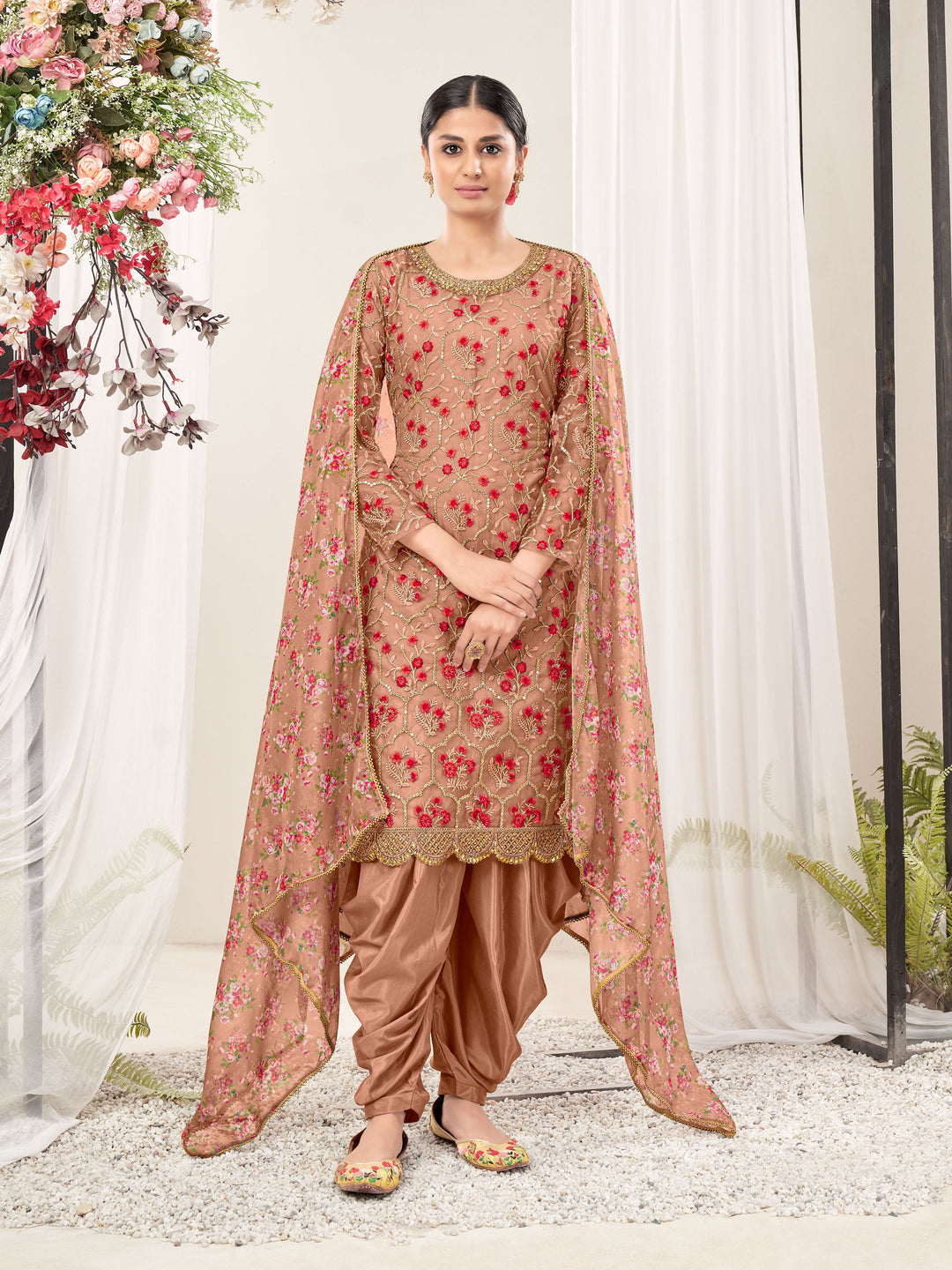 Chic brown salwar kameez set featuring designer embroidery, perfect for special events and celebrations.