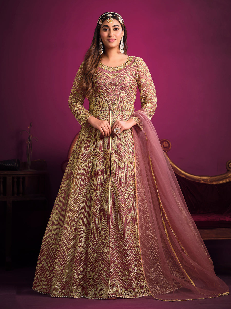 Dusty pink salwar kameez featuring heavy thread embroidery, zari, and sequins work, ideal for celebrations.