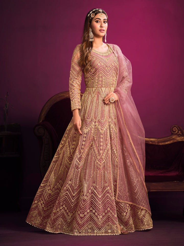 Beautifully crafted dusty pink salwar kameez showcasing exquisite detailing for weddings and special gatherings.