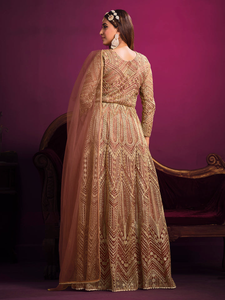 Light brown salwar kameez featuring heavy thread embroidery, zari, and sequins work, perfect for celebrations.