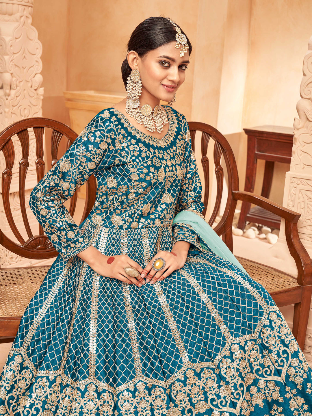 Beautifully crafted teal blue salwar kameez showcasing exquisite detailing for weddings and special occasions.