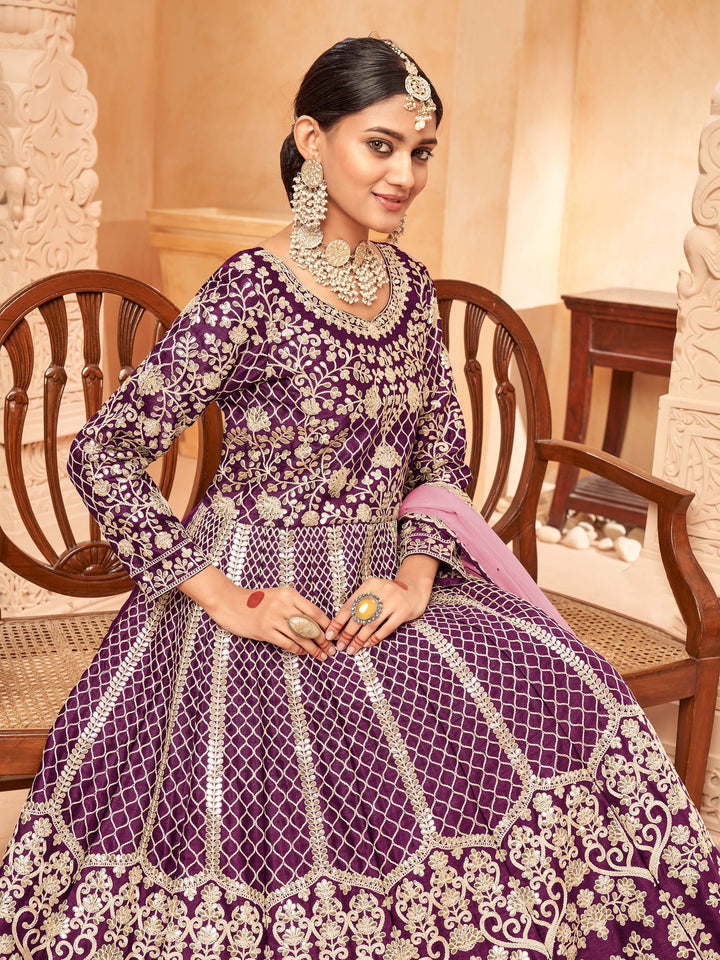 Beautifully crafted purple salwar kameez showcasing exquisite detailing for weddings and celebrations.