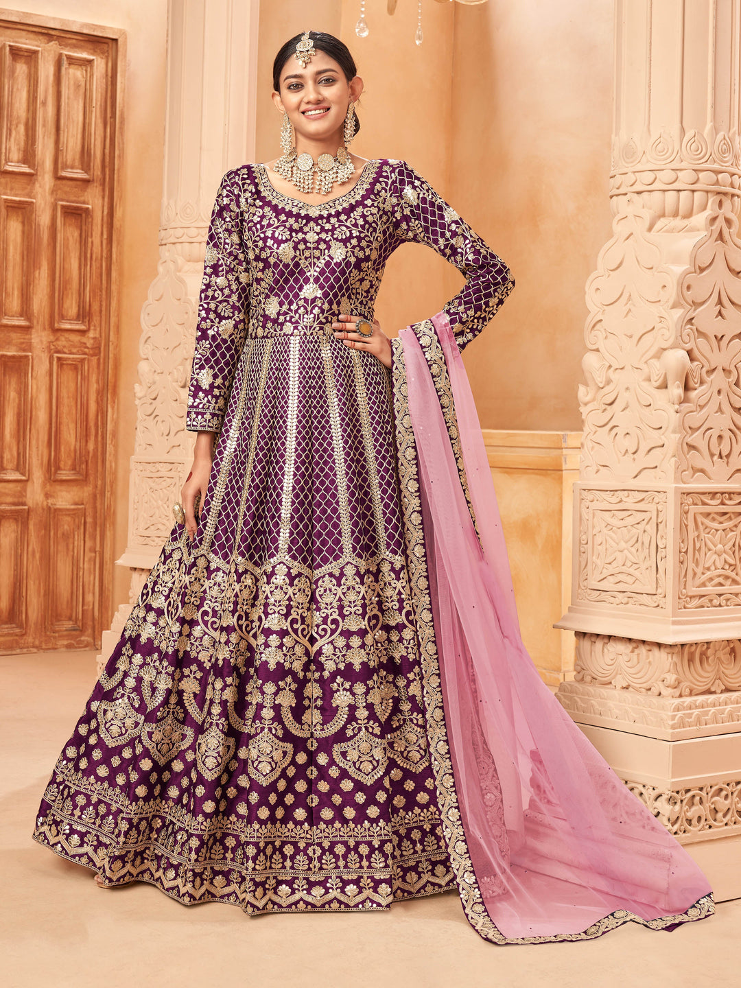 Purple art silk salwar kameez featuring heavy thread embroidery with zari work, perfect for special occasions.