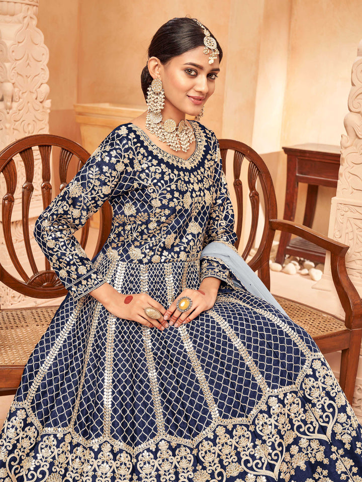 Chic navy blue salwar kameez with heavy embroidery and zari work, ideal for special occasions.