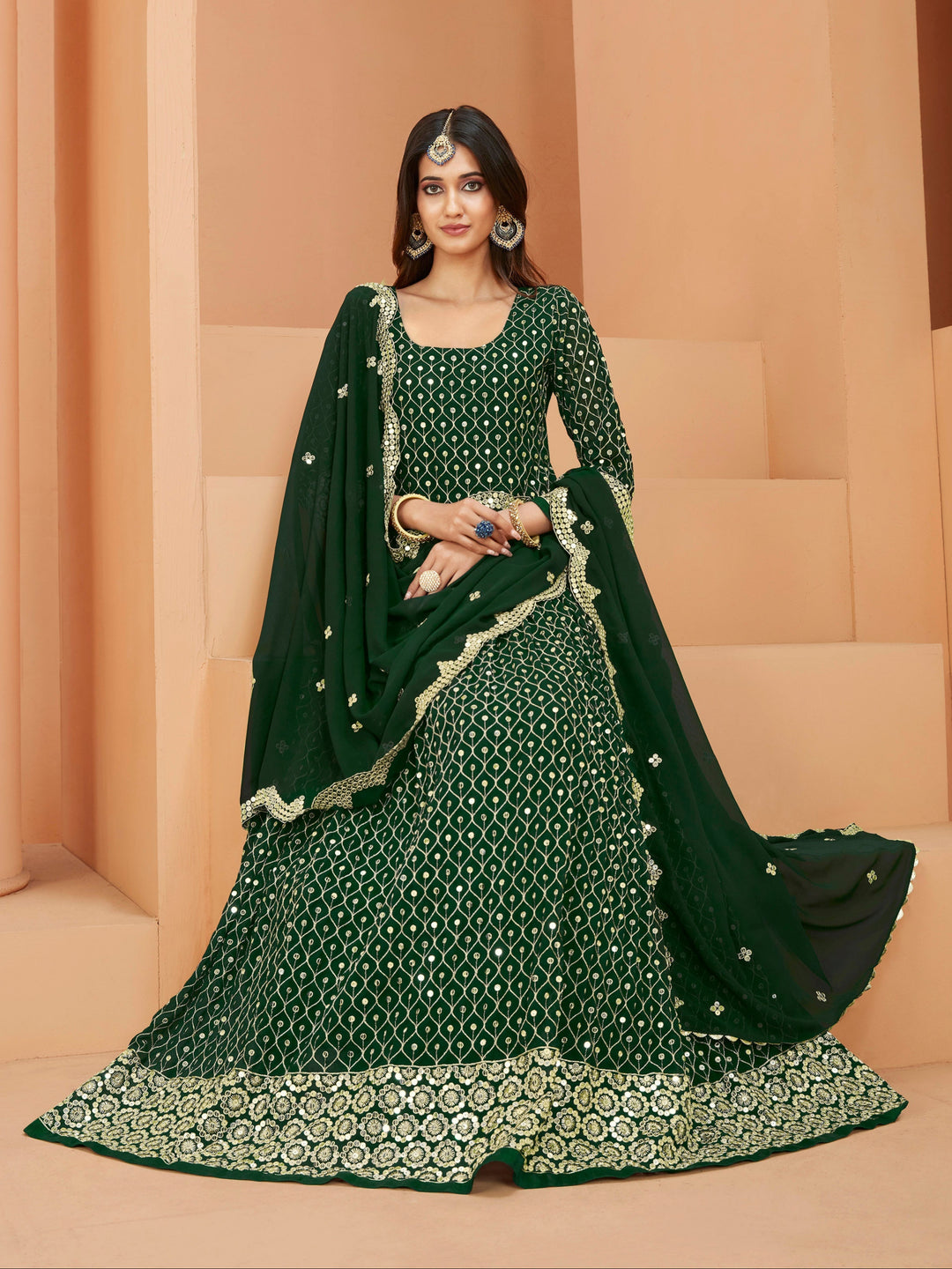 Stunning green salwar kameez showcasing intricate detailing with sequins for celebrations.