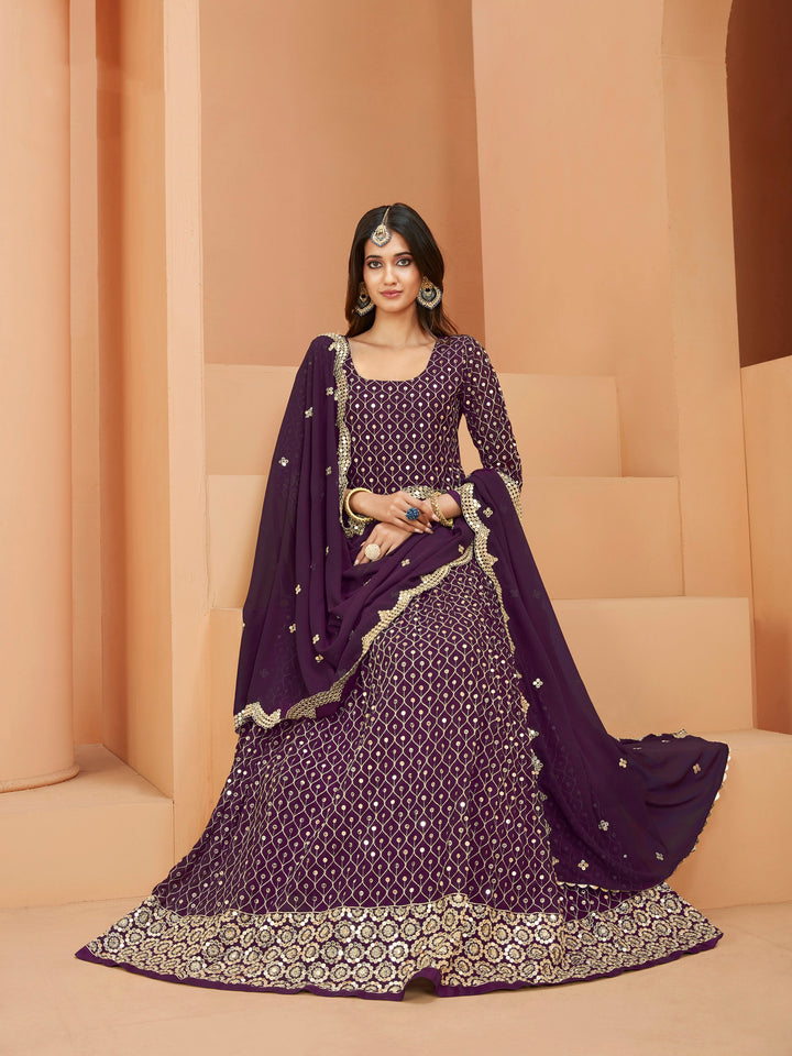 Beautifully crafted purple salwar kameez showcasing exquisite detailing for weddings and events.