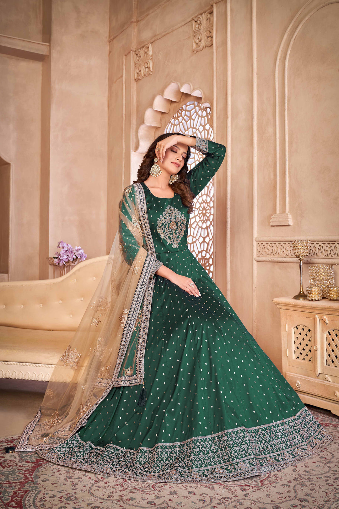 Chic green taffeta salwar kameez with heavy embroidery and sequins work, ideal for special occasions.