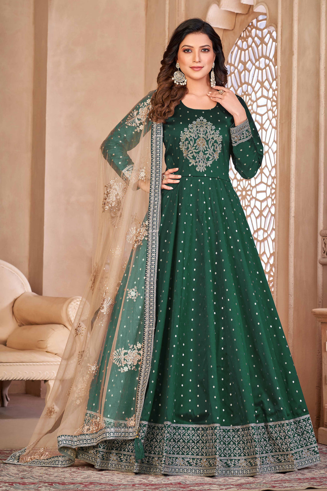 Green taffeta salwar kameez featuring butti design with heavy thread embroidery and sequins work.