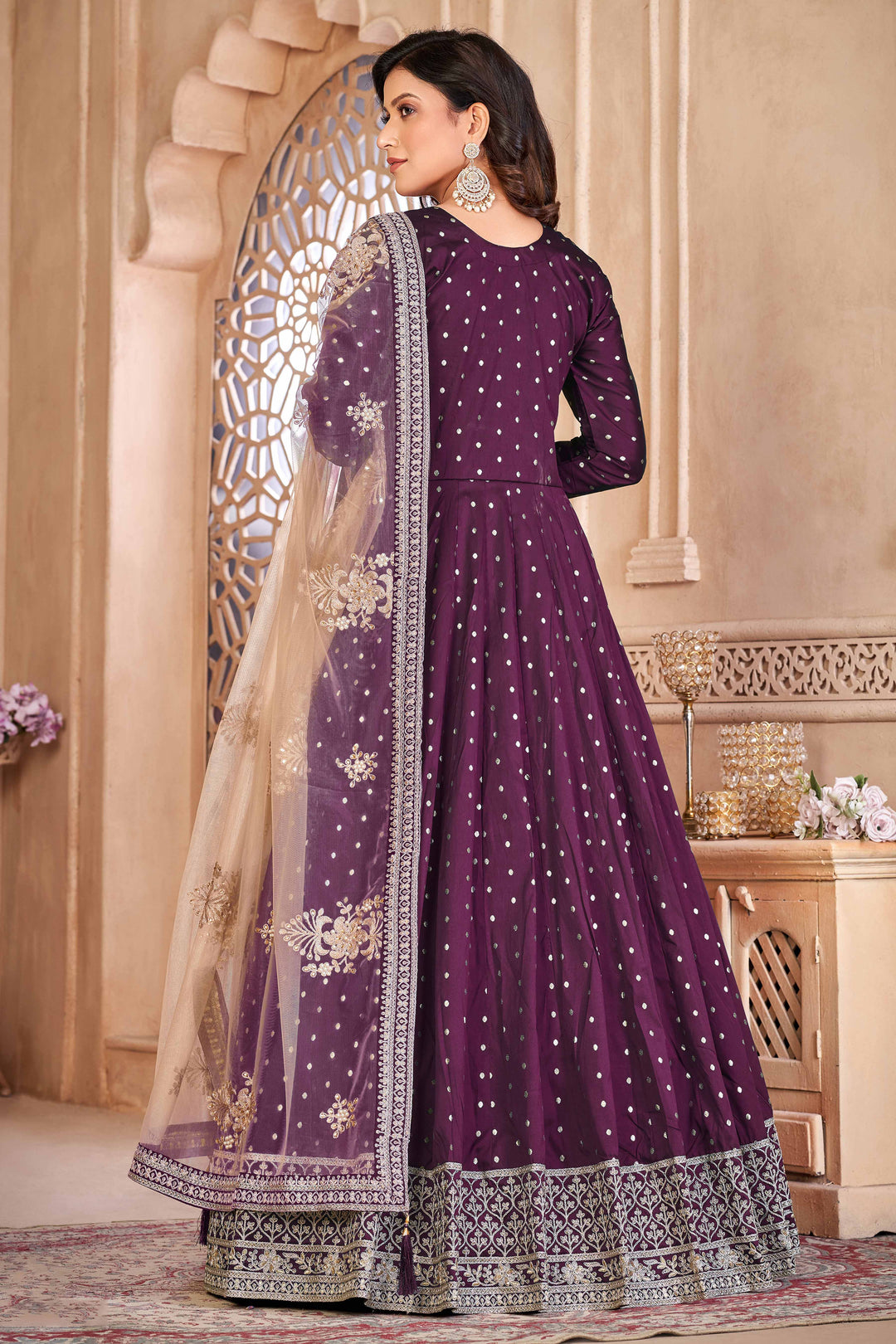 Luxurious wine salwar kameez showcasing exquisite detailing for weddings and events.