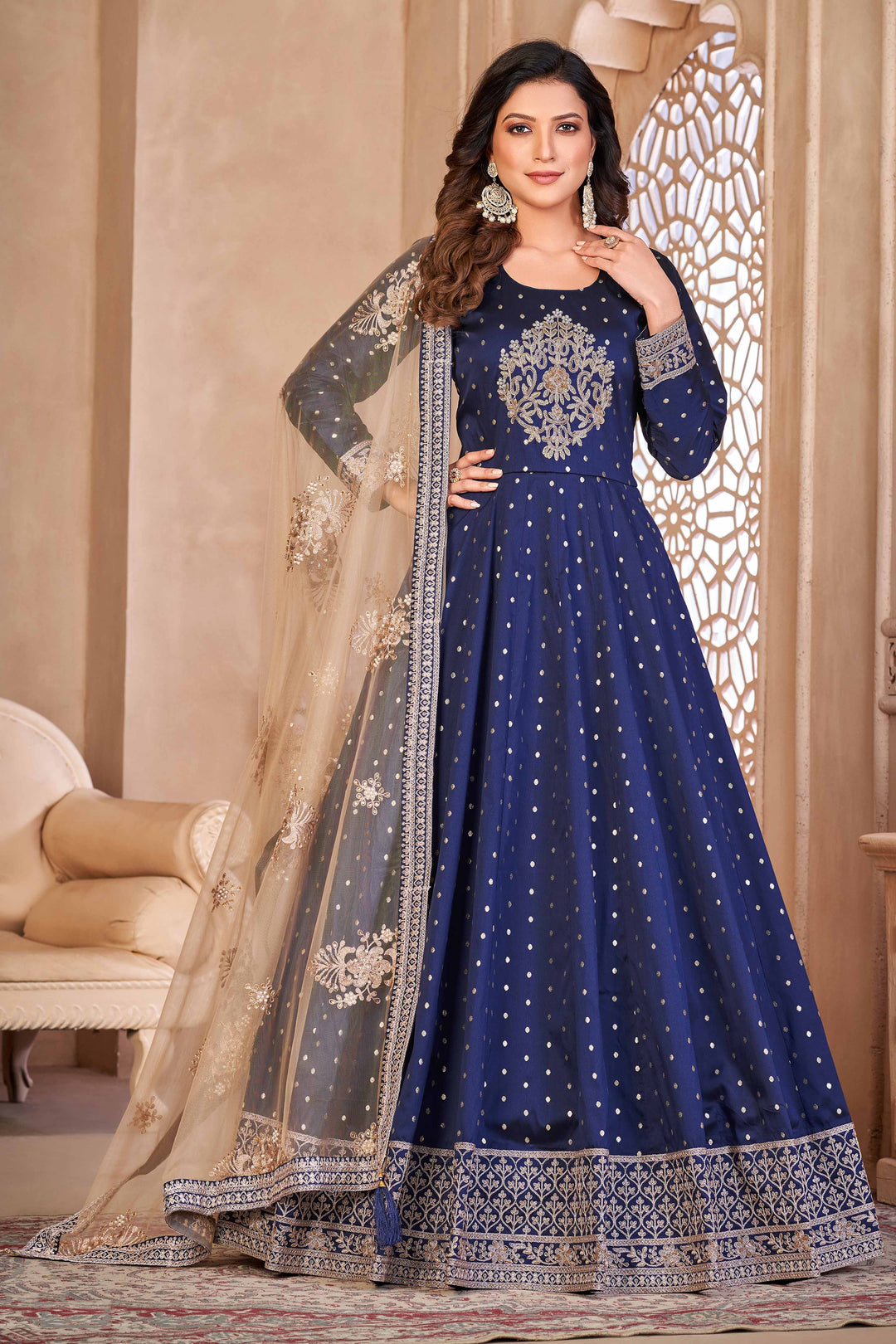 Blue taffeta salwar kameez featuring butti design with heavy thread embroidery and sequins work.