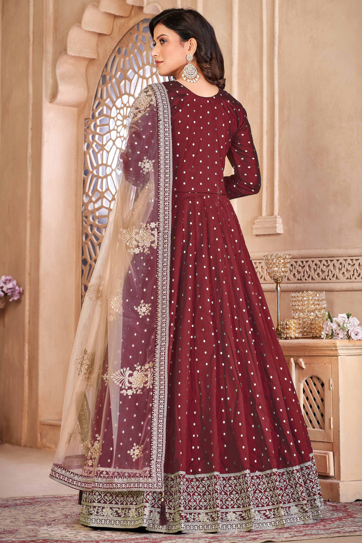 Luxurious maroon salwar kameez showcasing exquisite detailing for weddings and events.