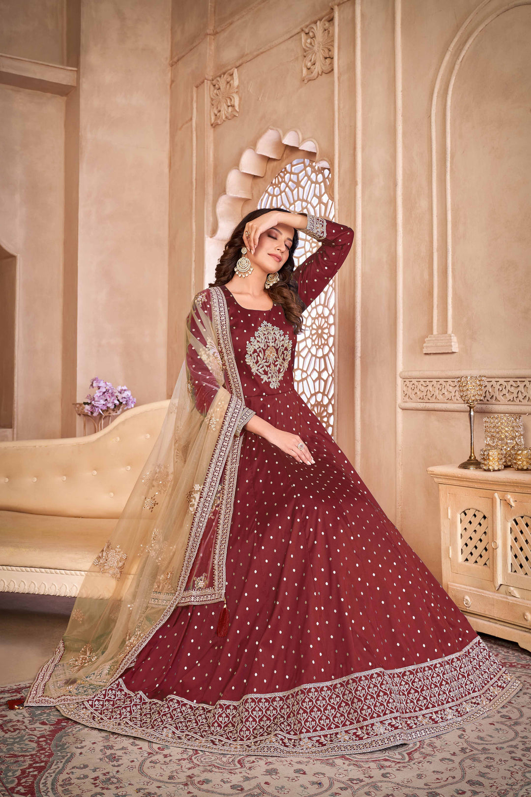 Chic maroon taffeta salwar kameez with intricate embroidery and sequins, ideal for festive occasions.