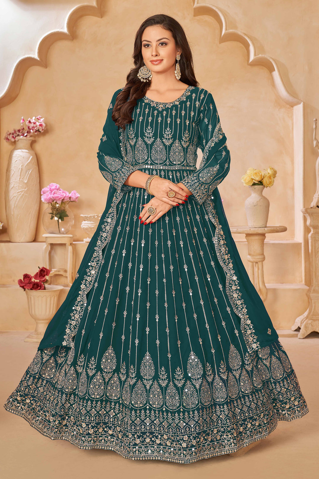 Elegant teal green salwar kameez designed for festive occasions and cultural gatherings.