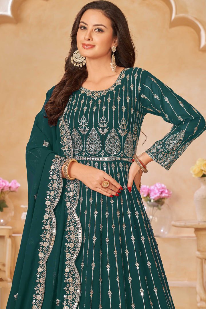 Stunning teal green salwar kameez showcasing intricate detailing for weddings and celebrations.