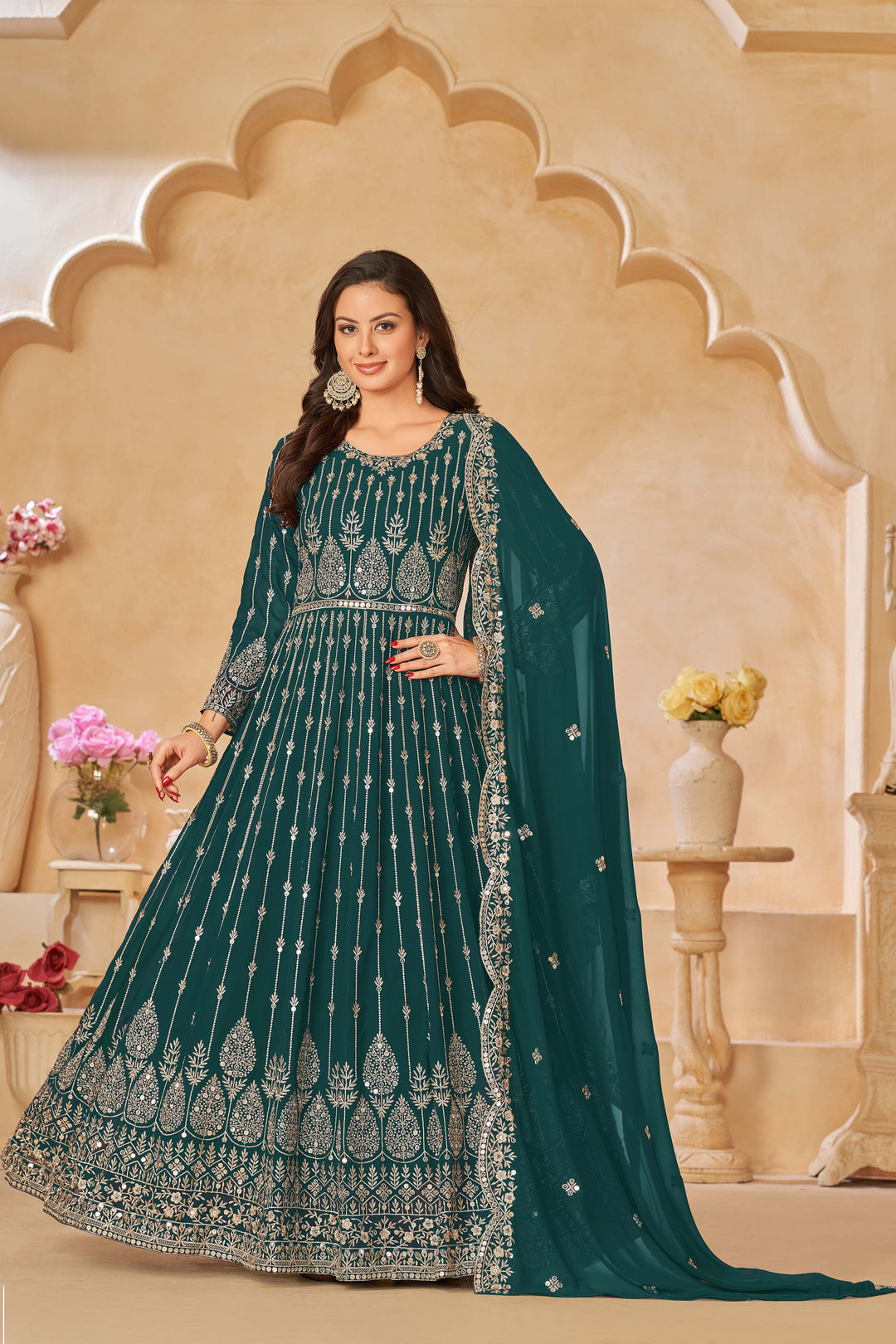 Chic teal green salwar kameez with heavy embroidery and sequins work, ideal for special occasions.