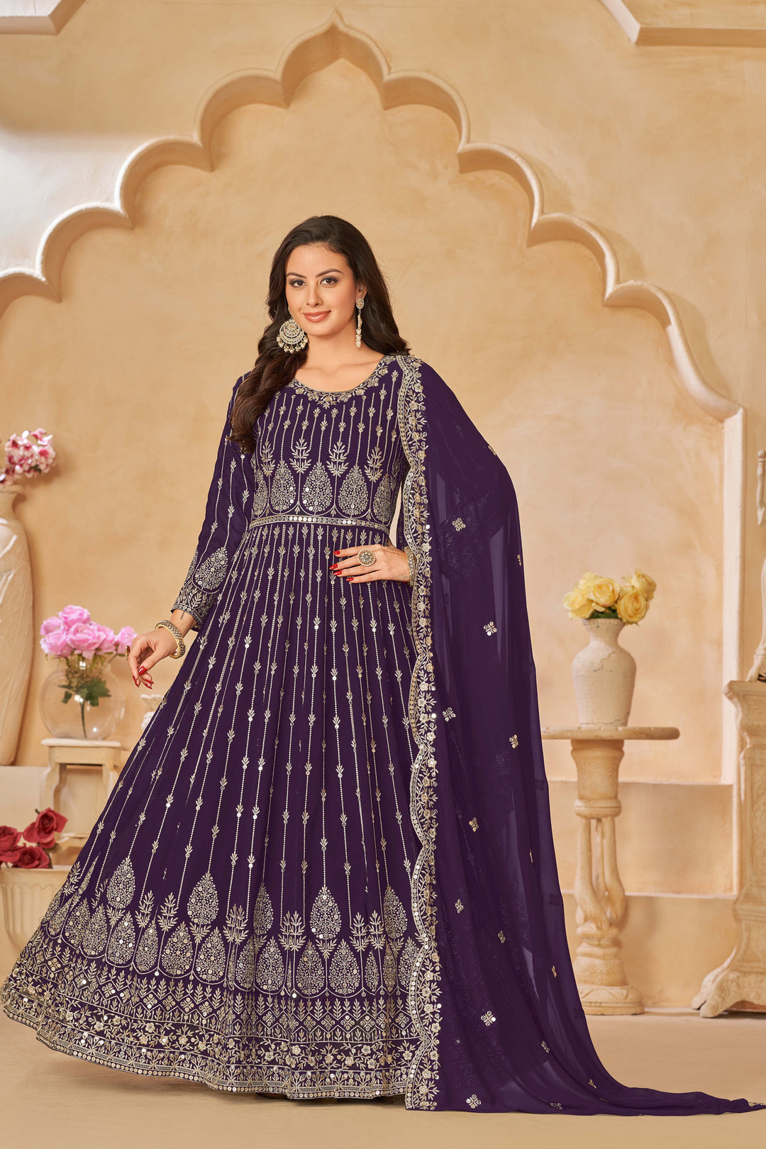 Stylish purple salwar kameez with intricate embroidery and sequins, ideal for festive occasions.