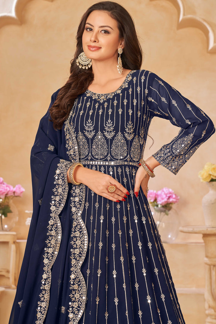 Stunning navy blue salwar kameez showcasing intricate detailing with sequins for celebrations.