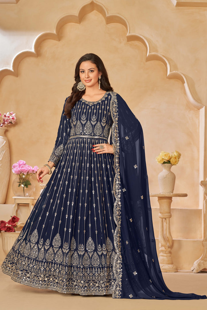 Chic navy blue salwar kameez with heavy embroidery and sequins work, ideal for special occasions.