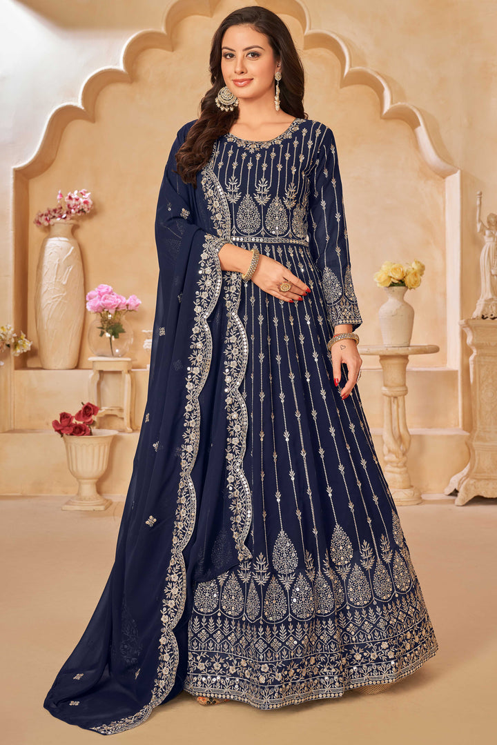 Navy blue faux georgette salwar kameez featuring heavy thread embroidery with sequins work.