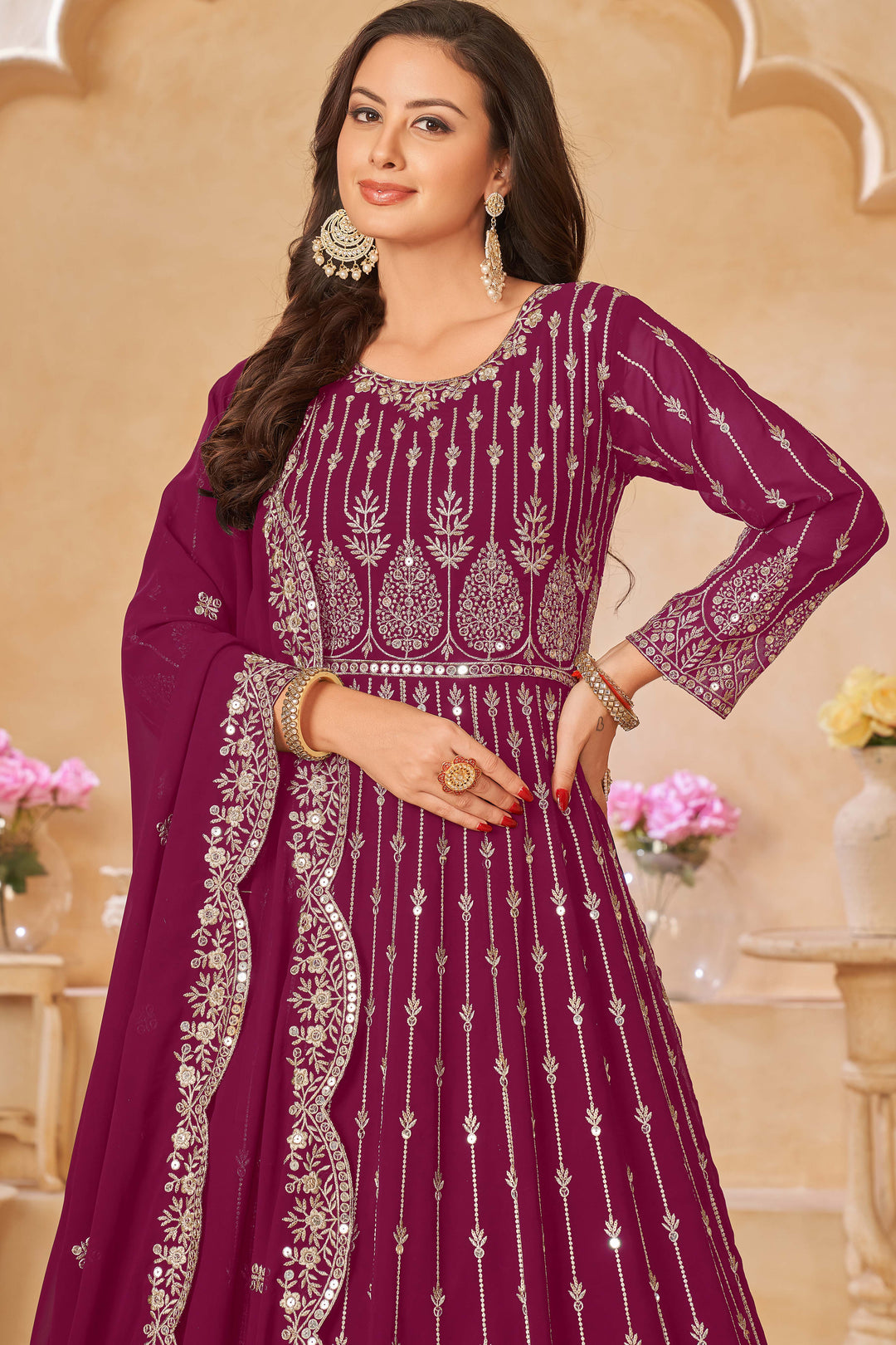 Luxurious rani pink salwar kameez showcasing exquisite detailing for weddings and events.