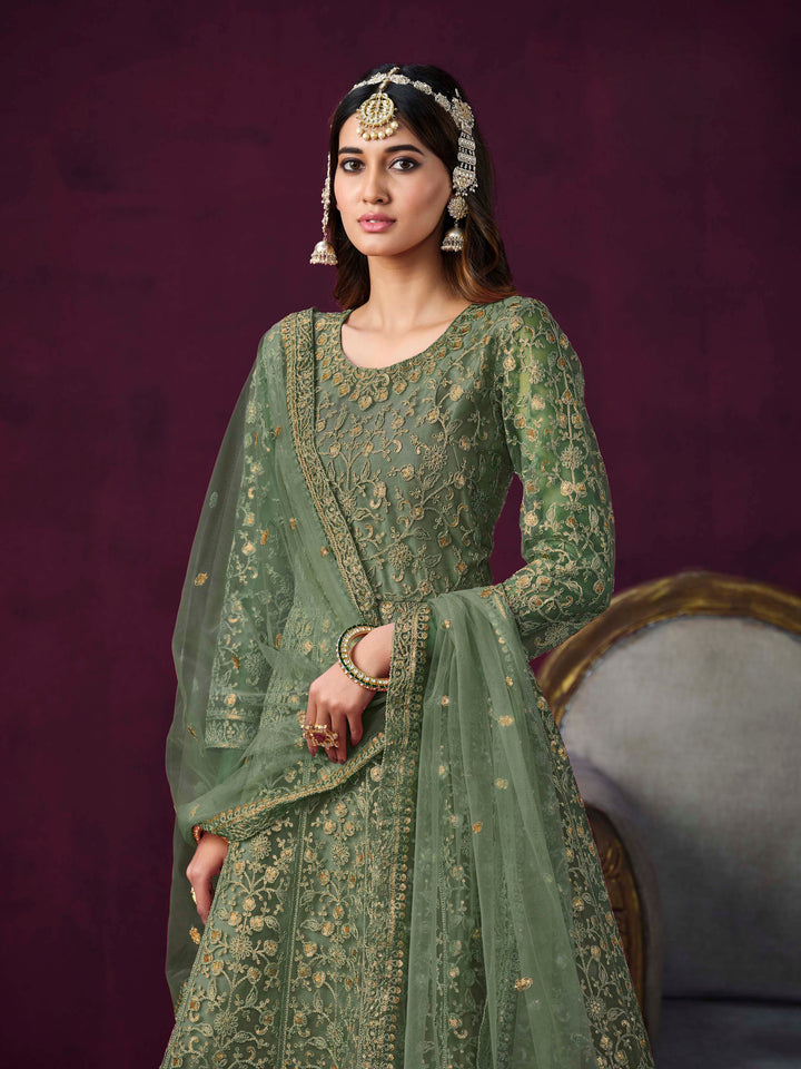 Luxurious mehendi salwar kameez showcasing exquisite detailing for weddings and events.