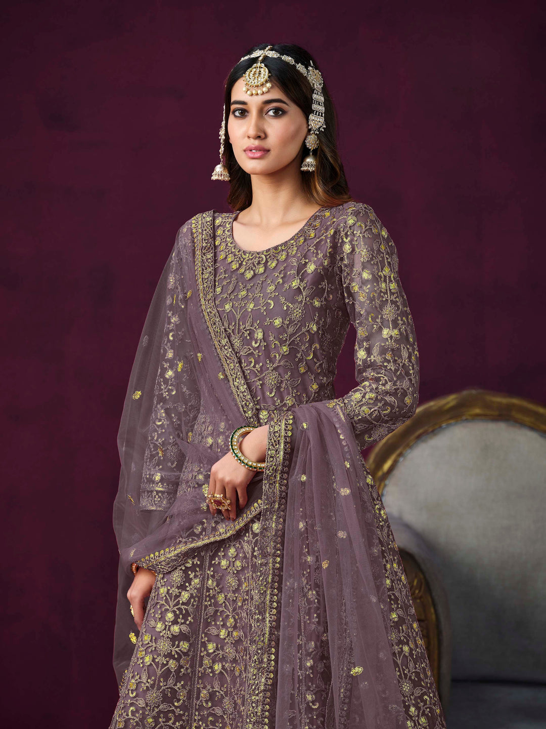 Stunning dusty purple salwar kameez showcasing intricate detailing for weddings and celebrations.