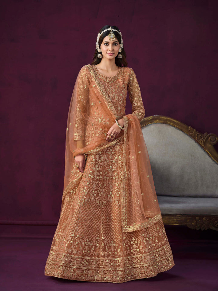 Chic coral salwar kameez designed for modern women, perfect for celebrations.