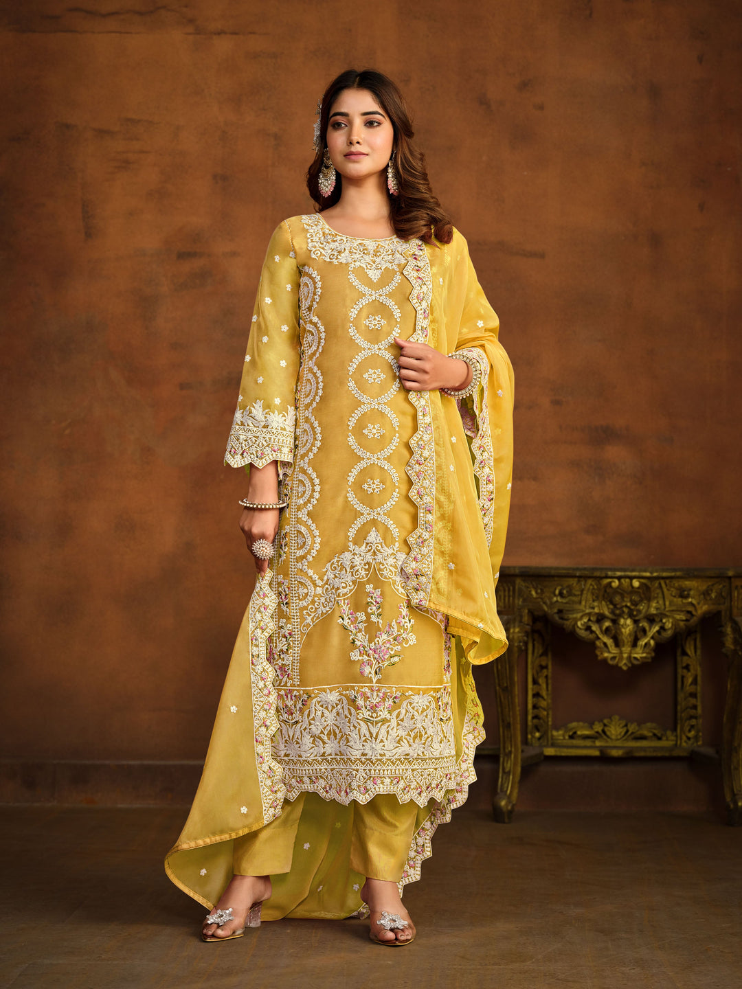 Elegant yellow salwar kameez designed for festive occasions and cultural gatherings.