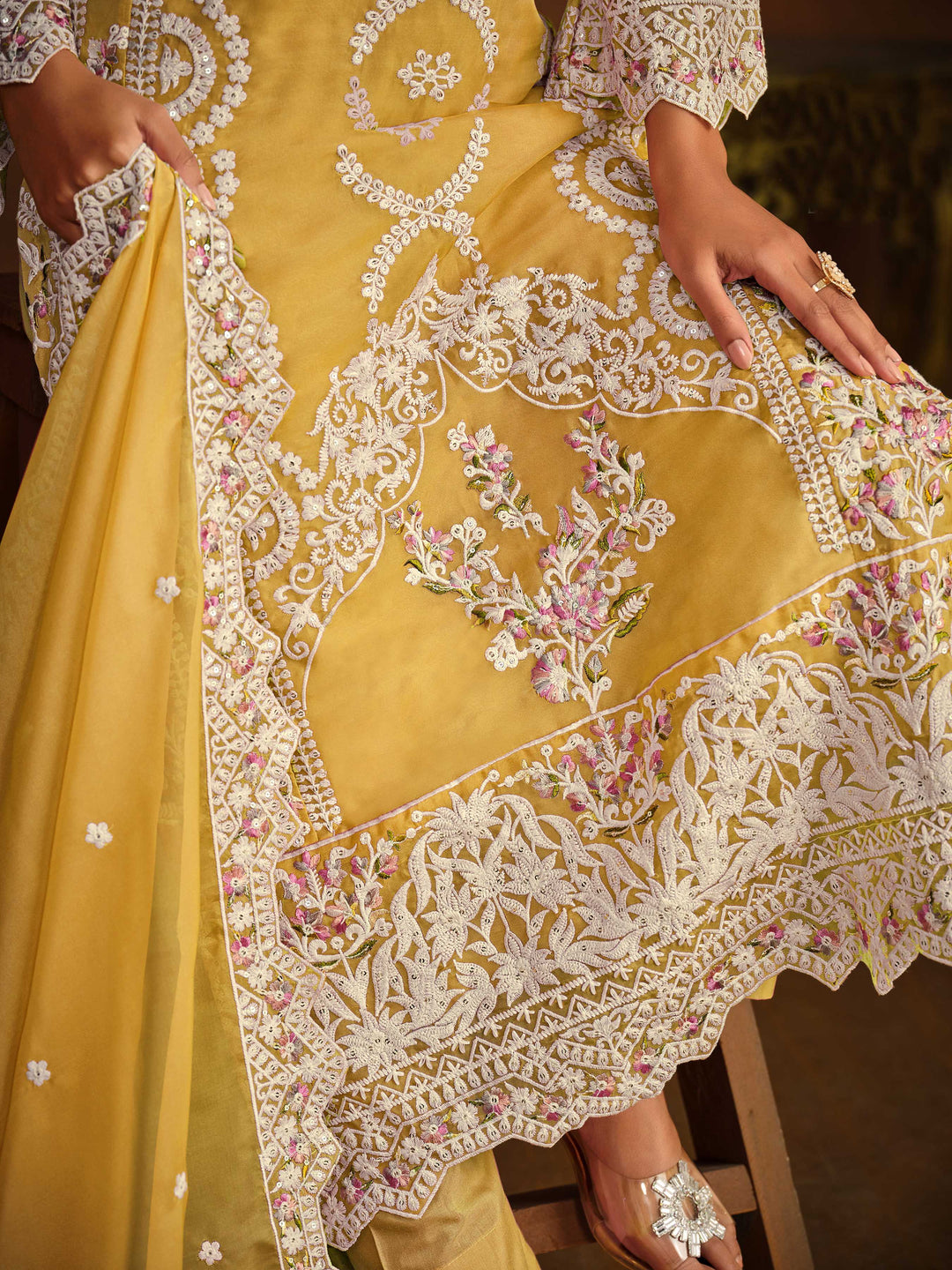 Stunning yellow salwar kameez showcasing intricate detailing for weddings and celebrations.