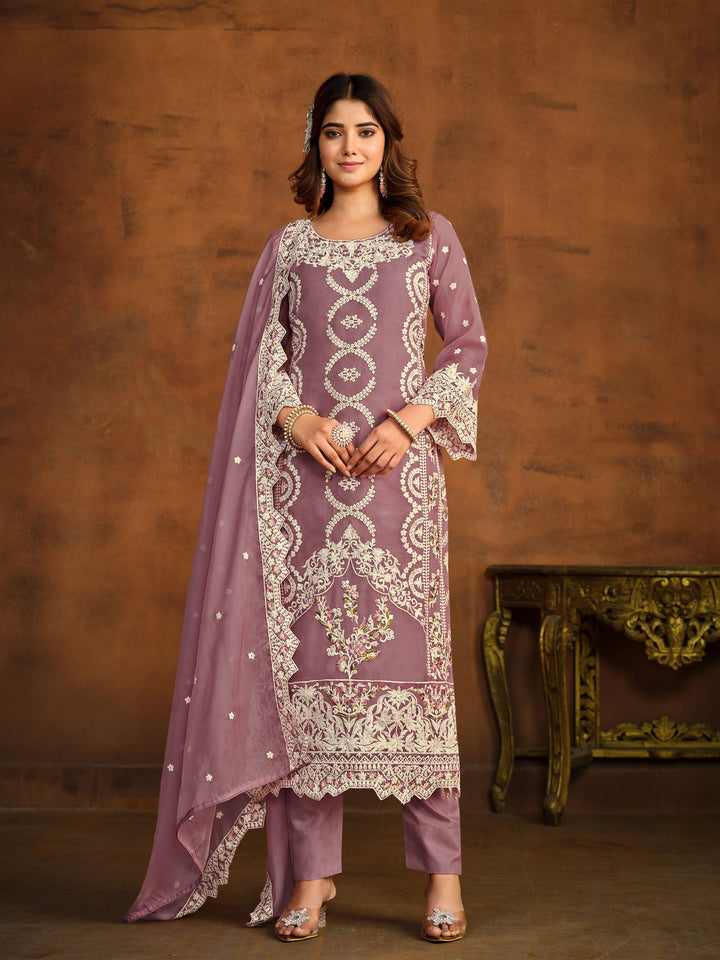 Mauve soft organza salwar kameez featuring heavy thread embroidery with sequins work.