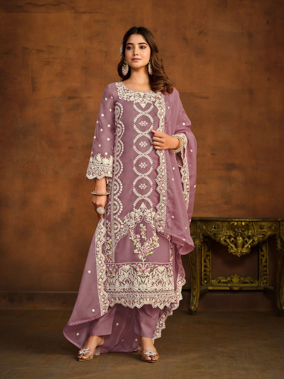 Elegant mauve salwar kameez designed for festive occasions and cultural gatherings.