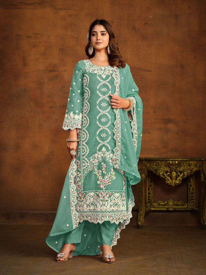 Elegant light green salwar kameez designed for festive occasions and cultural gatherings.