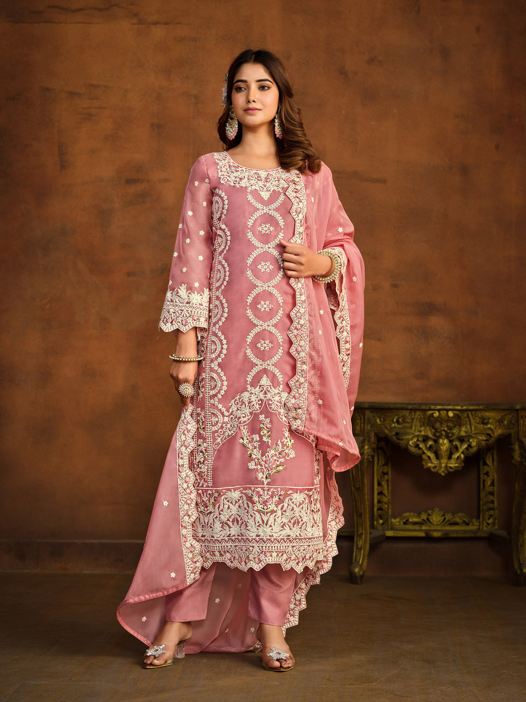 Elegant pink salwar kameez designed for festive occasions and cultural gatherings.