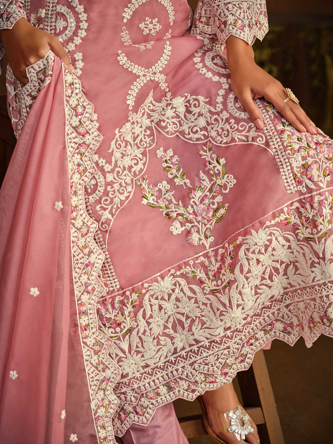 Stunning pink salwar kameez showcasing intricate detailing for weddings and celebrations.