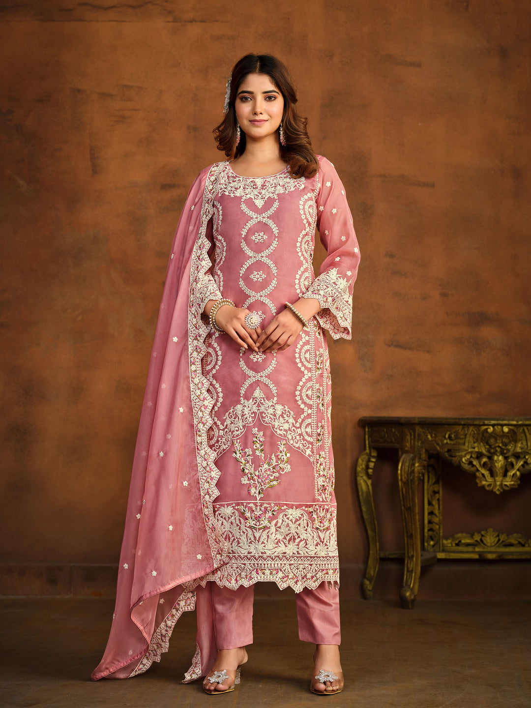 Pink soft organza salwar kameez featuring heavy thread embroidery with sequins work.