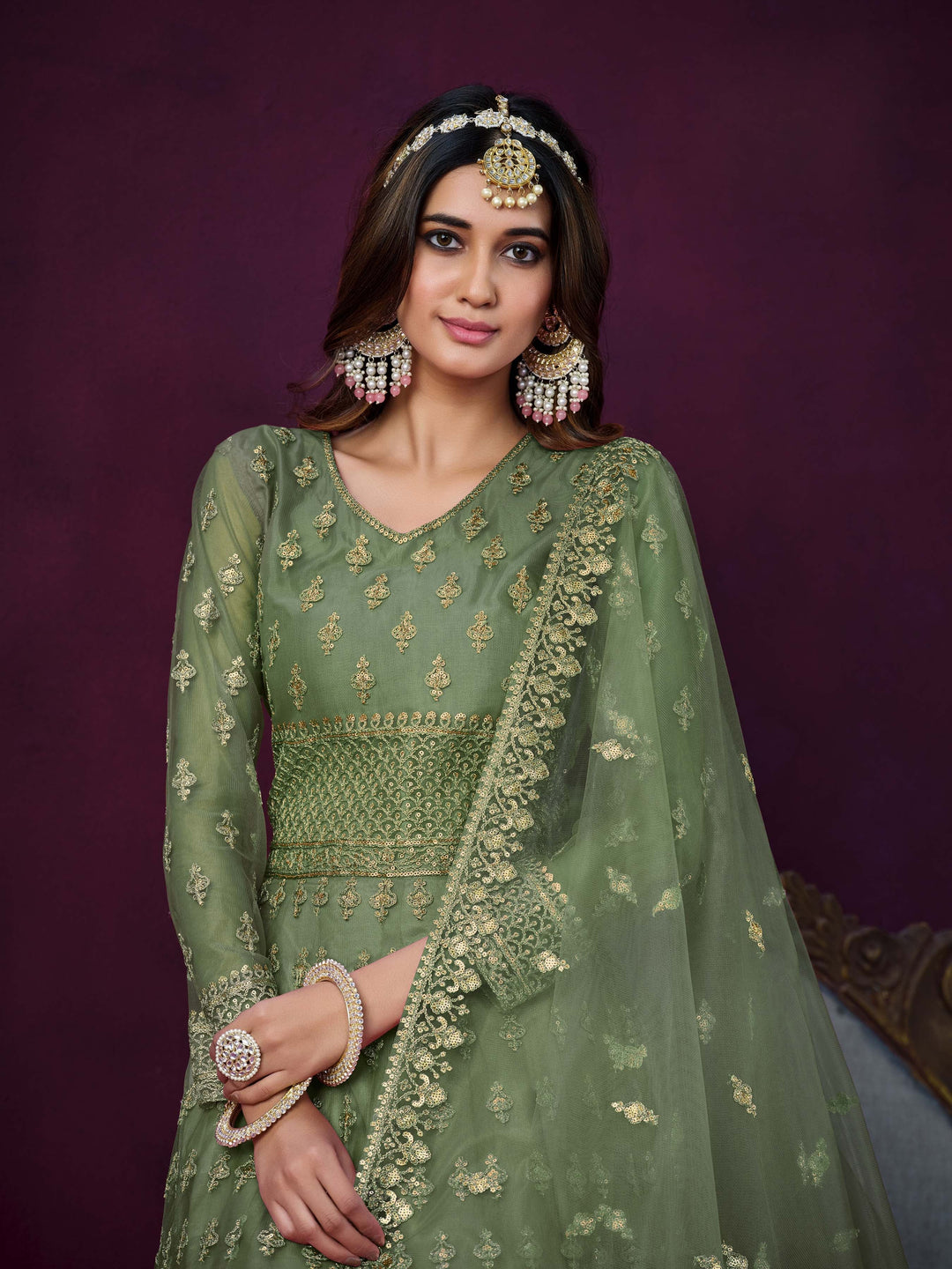 Luxurious mehendi salwar kameez showcasing exquisite detailing for weddings and events.