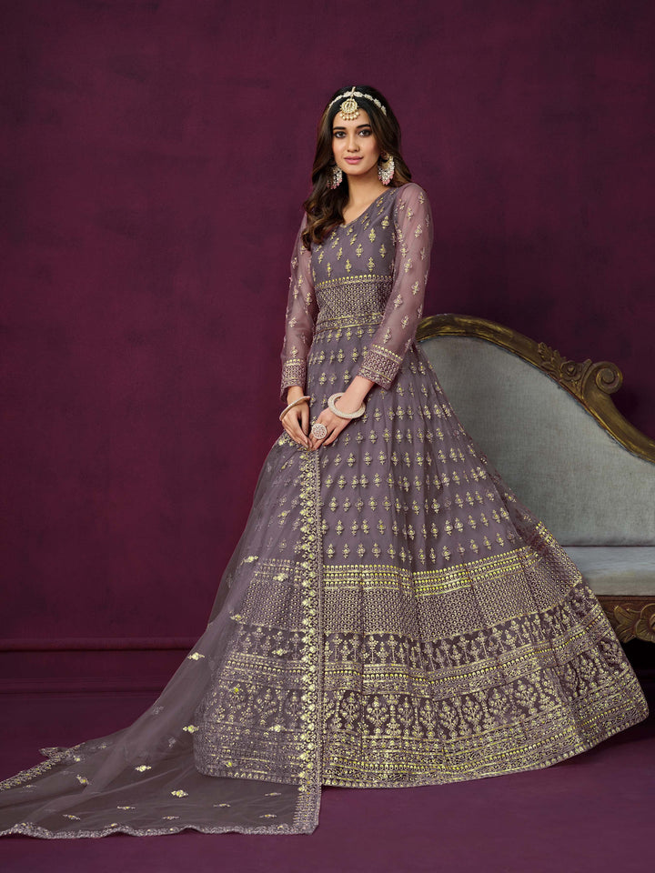 Elegant dusty purple salwar kameez designed for festive occasions and cultural gatherings.