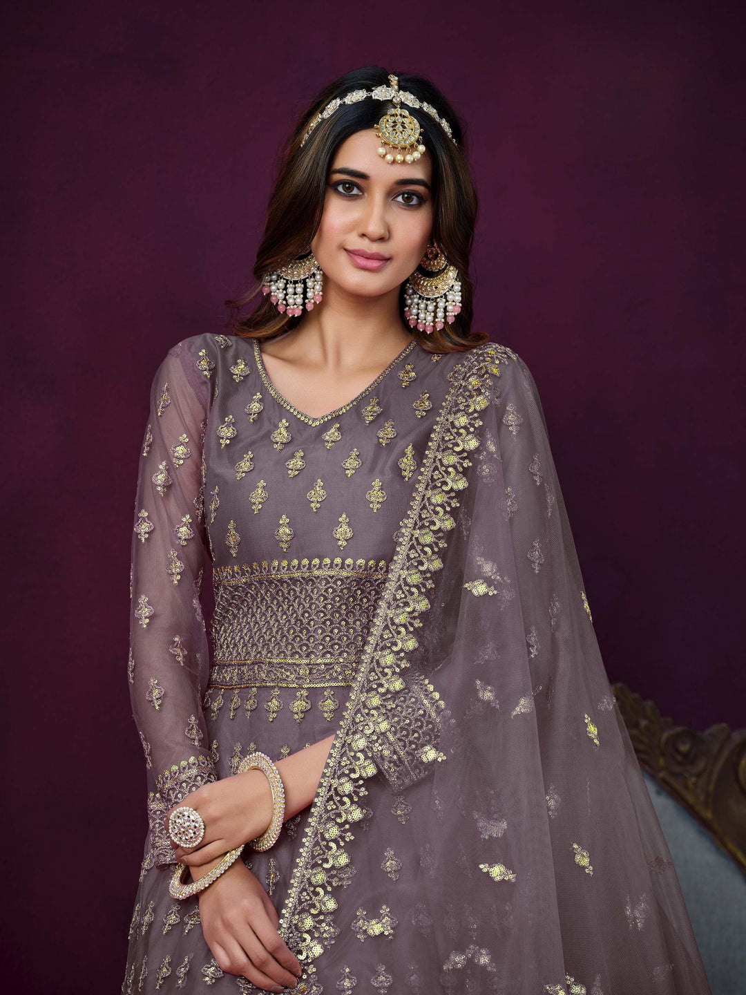 Stunning dusty purple salwar kameez showcasing intricate detailing for weddings and celebrations.