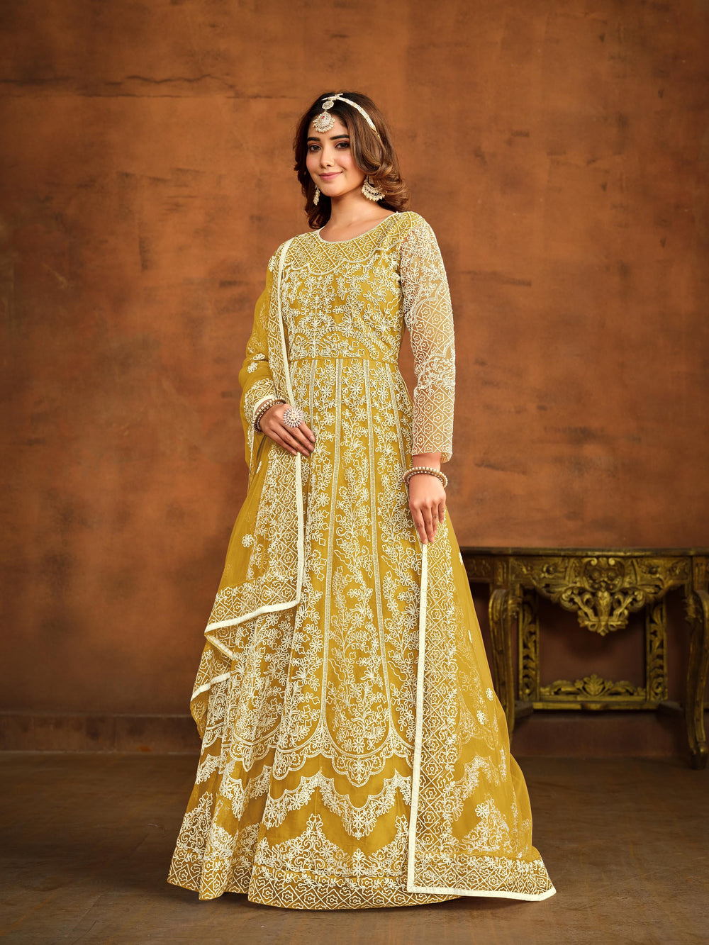 Elegant yellow salwar kameez designed for festive occasions and cultural gatherings.