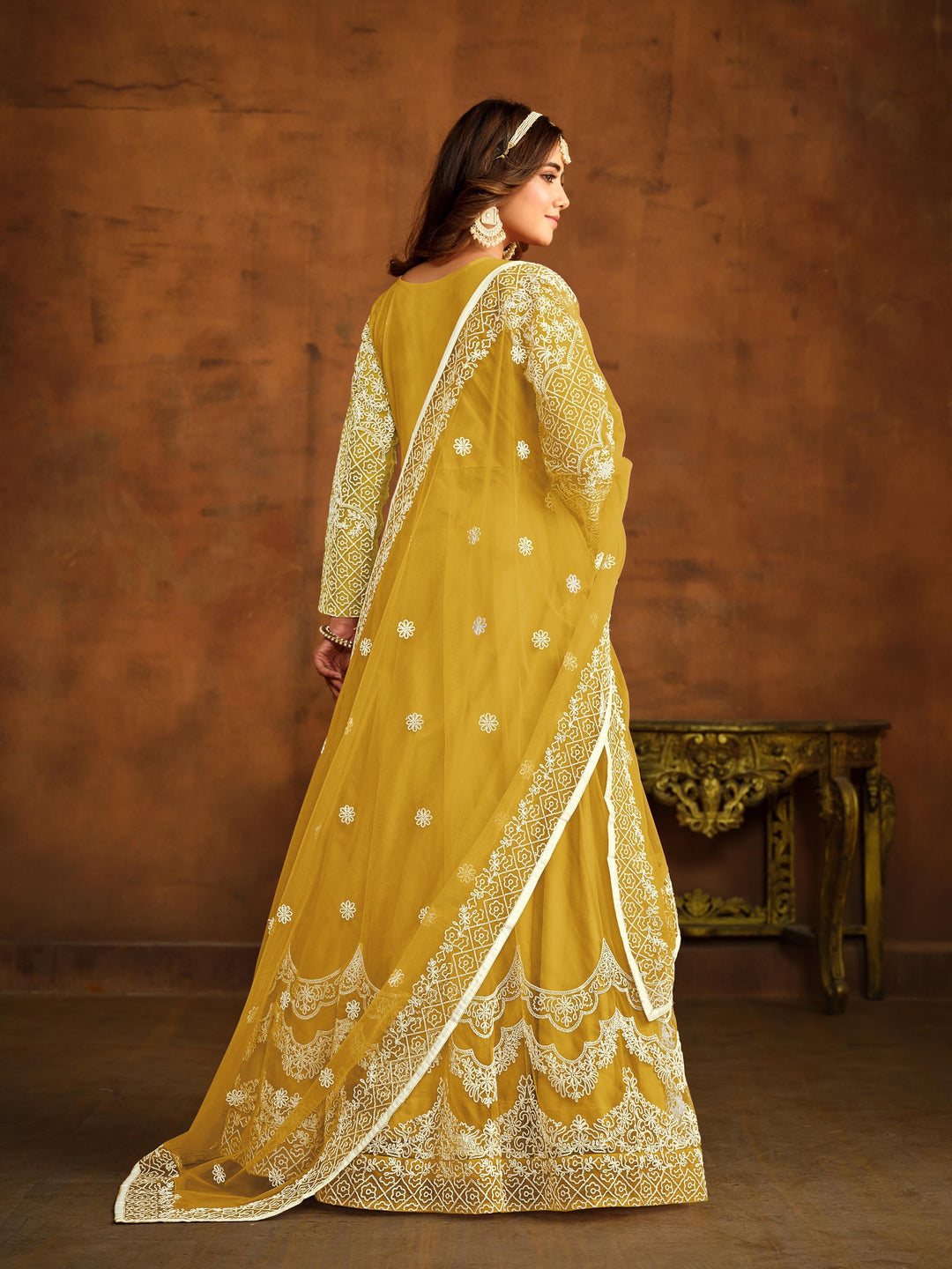 Stunning yellow salwar kameez showcasing intricate detailing for weddings and celebrations.